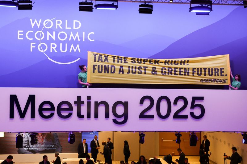 Greenpeace activists stage climate protest inside WEF meeting in&nbsp;Davos