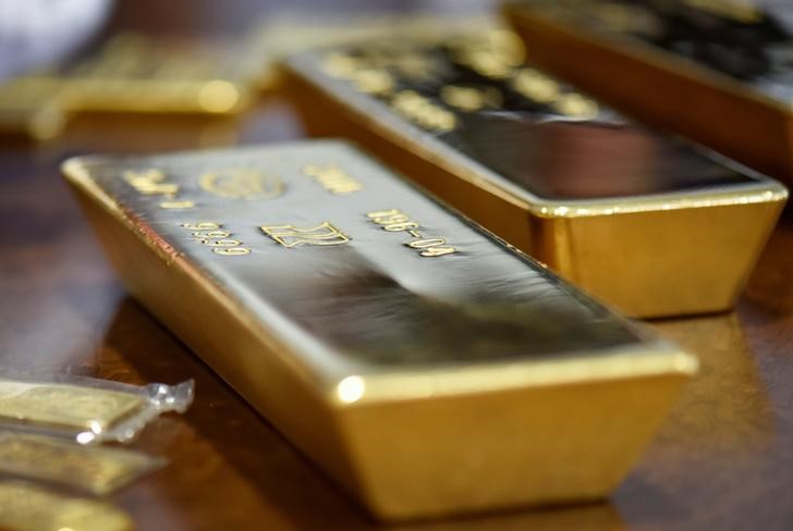 Gold slides as oil prices advance on Iran uncertainty; Fed decision&nbsp;ahead